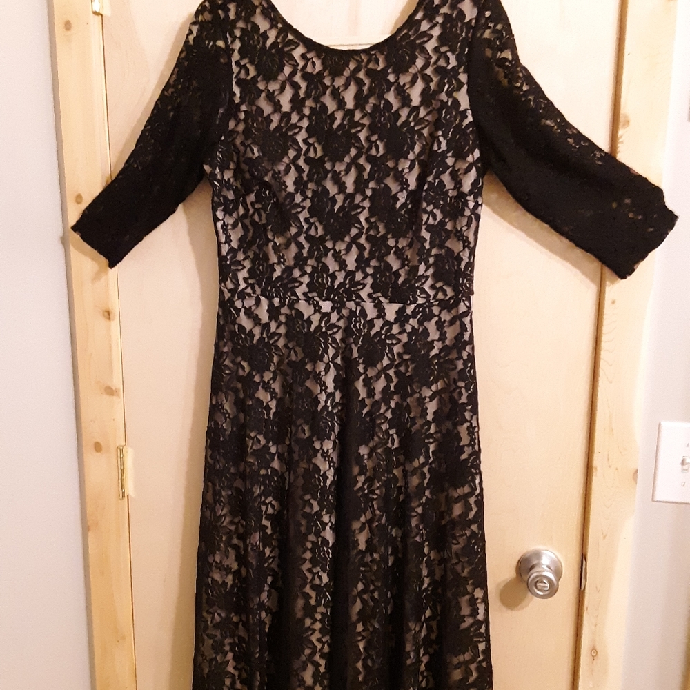 Black lace dress over nude lining. Size 12.